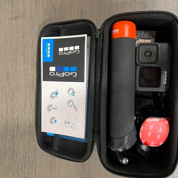 GoPro Black Camera with Orange Grip in Case